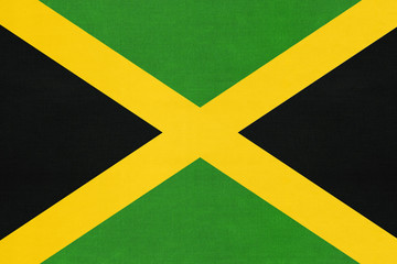 Jamaica national fabric flag, textile background. Symbol of North American world country.
