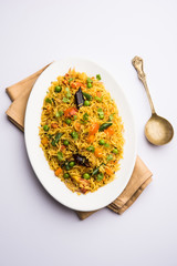 Tawa Pulao/Pulav/Pilaf/Pilau is an Indian Street Food  made using basmati rice, vegetables and spices. Selective focus