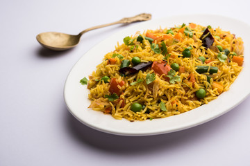 Tawa Pulao/Pulav/Pilaf/Pilau is an Indian Street Food  made using basmati rice, vegetables and spices. Selective focus