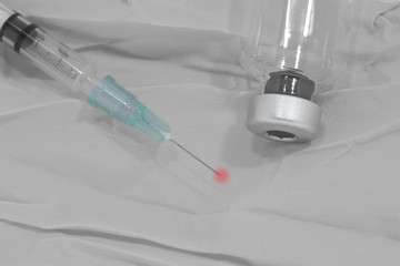 Close up the syringe insulin and iv drug lies on the table.The concept of taking drugs is tantamount to suicide, destruction. - obrazy, fototapety, plakaty