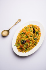Tawa Pulao/Pulav/Pilaf/Pilau is an Indian Street Food  made using basmati rice, vegetables and spices. Selective focus