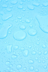 Close up water drops on blue background, Water drop in macro photography