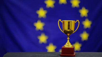Trophy on european union flag background. Victory concept