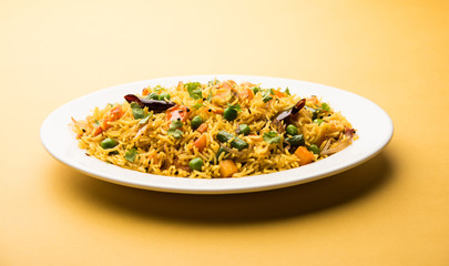 Tawa Pulao/Pulav/Pilaf/Pilau is an Indian Street Food  made using basmati rice, vegetables and spices. Selective focus