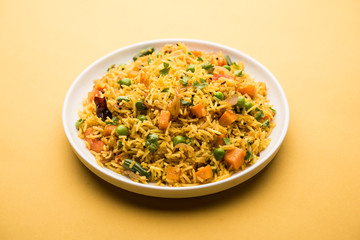 Tawa Pulao/Pulav/Pilaf/Pilau is an Indian Street Food  made using basmati rice, vegetables and spices. Selective focus