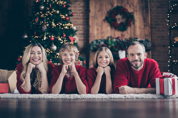 It's christmas time.Photo of dad mom sister brother spending x-mas eve together in harmony lying...