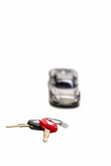 Auto Keys Against Scale Car. Vertical Image Composition