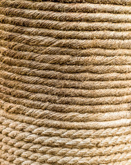 natural jute rope twisted wound pillar background, textile texture endless row