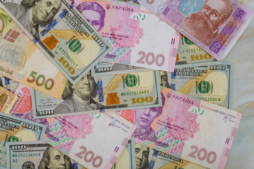 Money dollars and hryvnia, close-up top view concept finance