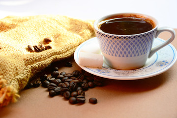 cup of coffee and cookies on table