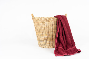 red towel with basket isolated on white background