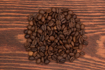 Coffee beans on brown wood