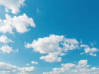 Blue sky background with cumulus clouds
