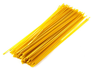 Dry long spaghetti yellow on white background