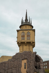 Wooden tower with a spire, Windows. Fortress, fairytale castle, architecture style.