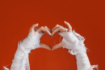 Halloween, costume image. The mummy's hand in bandages making gestures