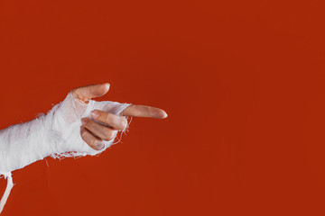 Halloween, costume image. The mummy's hand in bandages making gestures