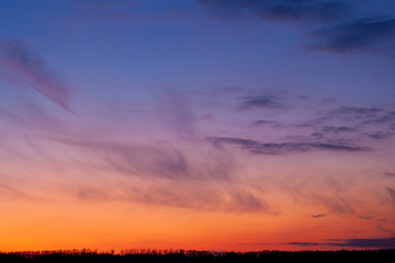 Beautyful sunset, colorful evening sky  and clouds on the horizon