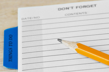 Open organizer with blank pages and a pencil