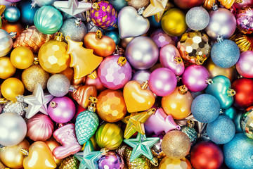 Many multi-colored christmas toys background texture. Top view.