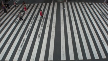 JAPAN : Aerial blurred high angle view of zebra crossing near Osaka train station. Crowd of people at the street. Shot in busy rush hour.