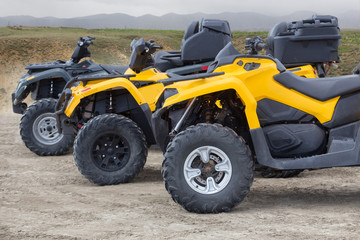 ATVs in the parking lot in the field
