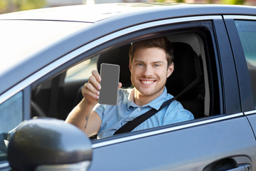 transport, driving and technology concept - man or car driver showing smartphone