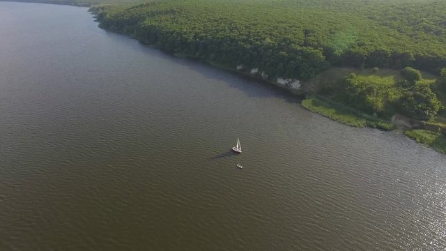 Ukraine, Kharkiv Oblast, Pecheneg Reservoir, July 24, 2019, sailing and motor yachts, boat trip, a beautiful video shot with a drone. 4k