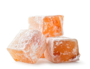 Turkish delight cubes with dried apricots closeup on a white. Isolated.