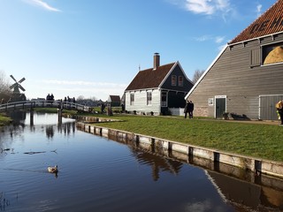 The Dutch Dutch suburb of Zaansche Schans. The water channels, the serene climate and the typical windmills.