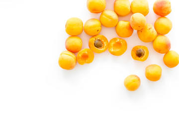 Fruit background with apricots on white background top view copy space
