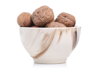 walnuts in bowl on white background isolation