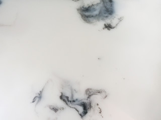 Marble texture, The smooth polished white marble surface has a black pattern of stone on the background.