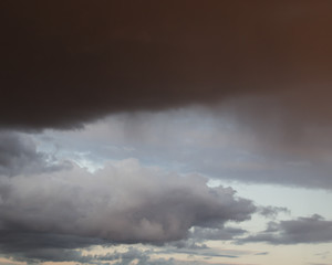 Dramatic sky before the rain with an impending black cloud.