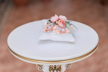 wedding rings on pillow