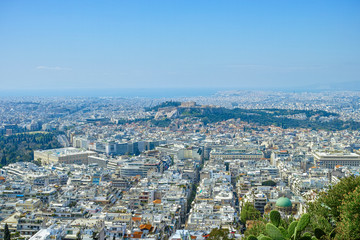 Athens in spring, view from hill,  cityscape with streets and buildings, ancient urbal culture