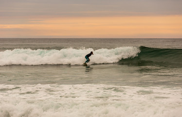 Surfer at sunset