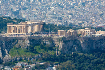 Fototapeta premium Athens in spring, view from hill, cityscape with Acropolis, streets and buildings, ancient urbal culture