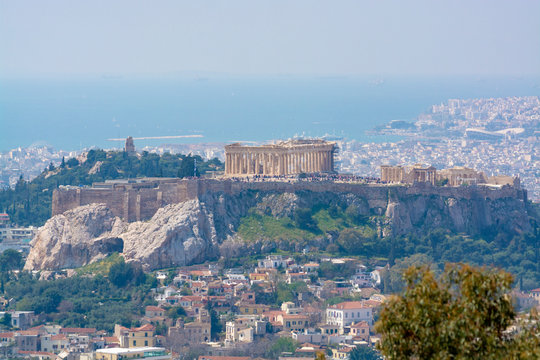 Athens in spring, view from hill,  cityscape with Acropolis, streets and buildings, ancient urbal culture