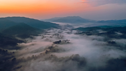 Sunrise in the morning mountains and fog