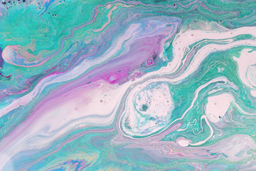 Purple pastel marble pattern with green glitter. Abstract liquid background