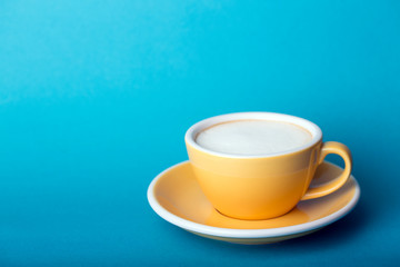 yellow cup on a blue background