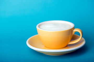 yellow cup on a blue background