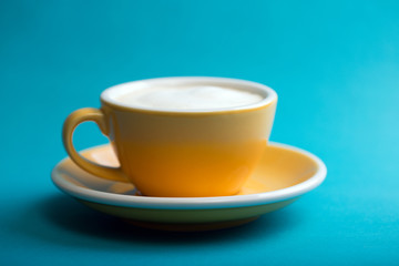 yellow cup on a blue background