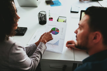 Executive businesswoman planning investment business project and strategy with her male partner in...