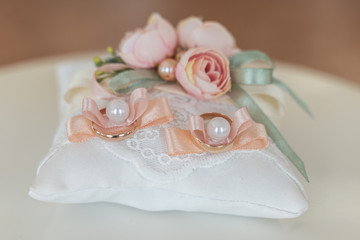 wedding rings on pillow