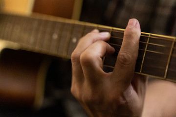 playing acoustic guitar