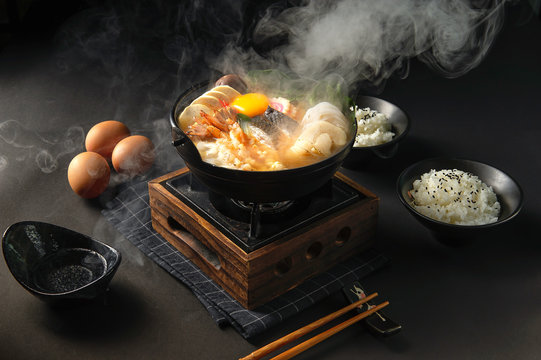 Japanese hotpot buta akakara nabe with pork rice set . In lighting studio . with copy space .