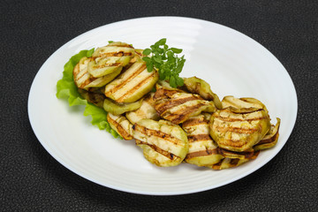 Grilled eggplant slices served basil