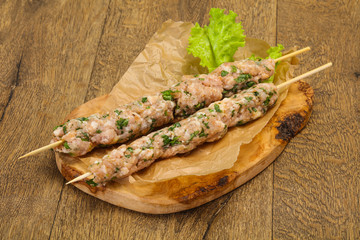 Raw minced pork skewer kebab for grill